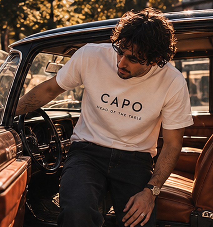 Capo tee beside a vintage car